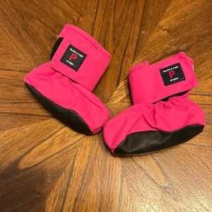 Hot pink baby booties.